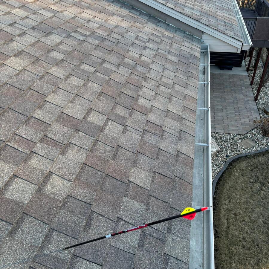 Completed shingle roof and new gutter line from above